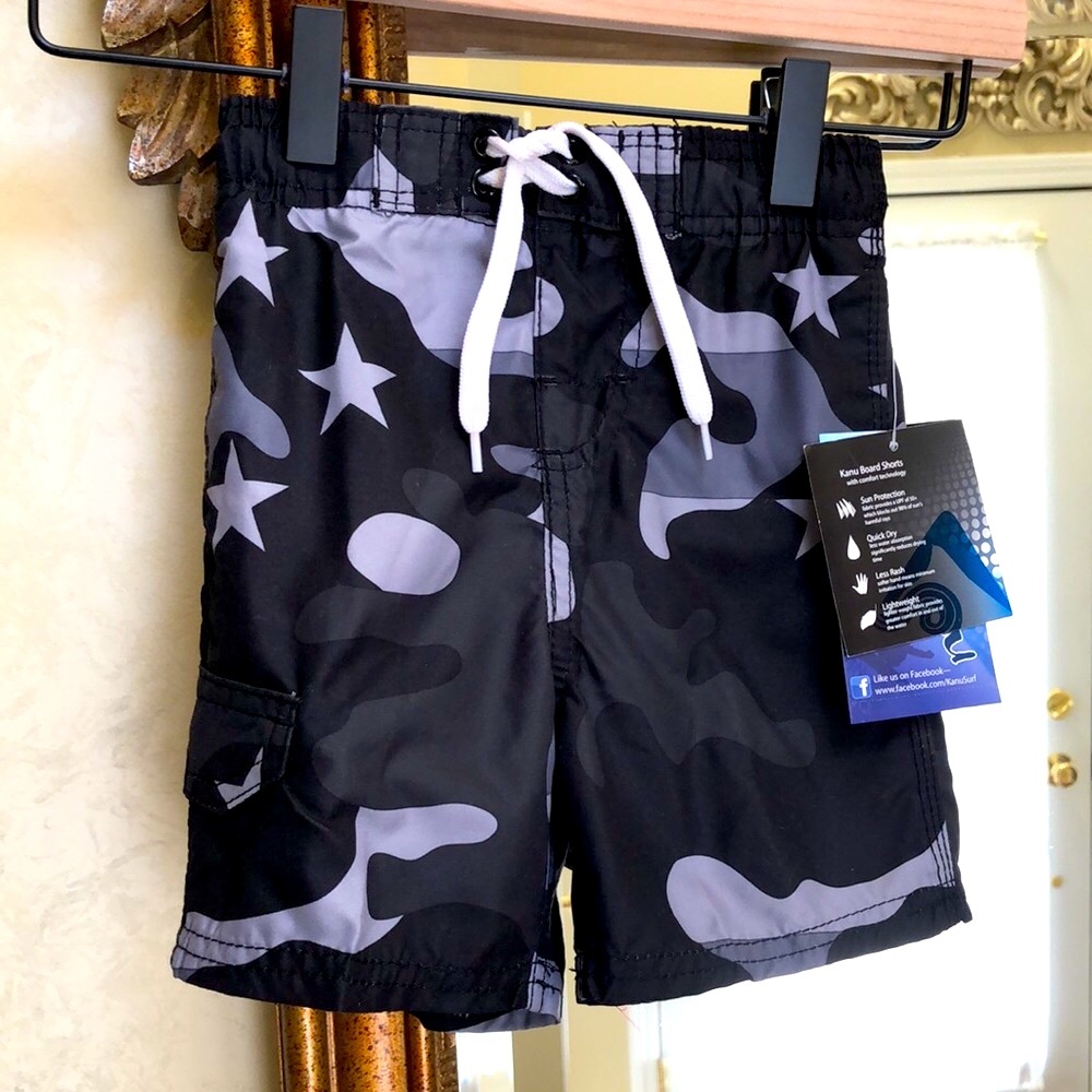 New Boy’s Kanu Surf swim trunks.  Size 3T. Elastic waist. White front tie.
